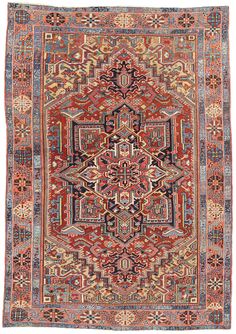 an antique persian rug with red and blue colors