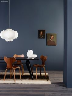 an image of a dining room with blue walls