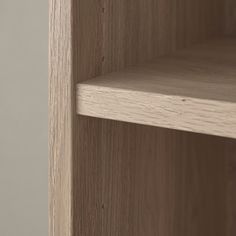 a close up view of a wooden shelf with no one in the room around it