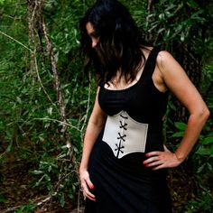 These corsets are the perfect costume accessory for any Renaissance, Medieval, Fairy, Elvish, and many more cosplay outfits.  These corsets are great quality with embroidered edges, metal eyelets, and leather ties.  They have a very comfortable fit made from vinyl leather and the elastic straps will contour to your body and snap in the back.   FAUX LEATHER COLOR OPTIONS: 14 Colors available ELASTIC COLOR: Elastic will be BLACK for all corset belts. SIZE OPTIONS: Recommended for Kids & Youth X-Small: 23" - 27" length Small: 26" - 32" length Recommended for Adult  Medium: 32" - 36" length Large: 36" - 42" length X-Large: 40" - 46" length Black Steampunk Corset Belt For Larp, Medieval Black Corset Belt For Festivals, Black Medieval Corset Belt For Larp, Black Steampunk Corset For Larp, Black Fantasy Corset Belt For Cosplay, Punk Underbust Corset For Fantasy Events, Black Overbust Corset For Cosplay Events, Black Fantasy Corset For Cosplay Events, Punk Style Corset For Cosplay Events