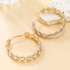 An Evening Of Elegance Would Not Be Complete Without These Glamorous, Rhinestone Hoops!
IRON, BRASS, GLASS

Color: Gold
Hoop Earring Detail
Rhinestone Detail
Clear Gem Detail
Textured Detail
2.5" Drop Length
2.5" Diameter Rhinestone Hoop Earrings, Gold Hoop Earring, Creepy Images, Chill Room, Summer Linen, Jean Accessories, Brass Glass, Glass Color, Christmas Earrings