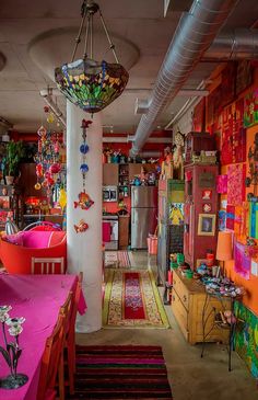 a room filled with lots of colorful furniture and decor