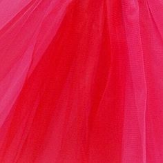 a close up of a pink tulle on a mannequin