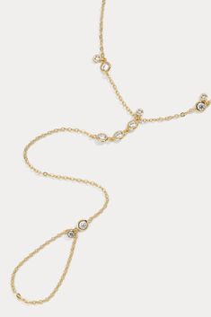 Delicate cable link hand chain embellished by tiny white-cz bezels  Available in 14kt gold plated brass or Rhodium plated brass Stones are White Cz, and measure 1.0mm - 3.0mm each 2" extender chain  Lobster clasp fastening Size 12 ring opening   Product Care: METAL: Use a soft cloth to gently wipe clean, then remove an Lili Claspe Jewelry, Lili Claspe, Belly Chain, Hand Chain, Jewelry Cleaner, Jewelry Pouch, 14kt Gold, Body Jewelry, Rhodium Plated