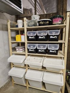 the shelves are filled with plastic containers and bins for storing items or other things