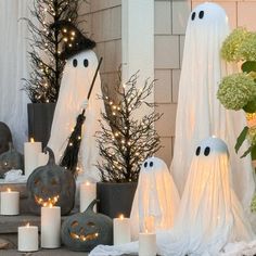 halloween decorations with candles and fake ghost heads