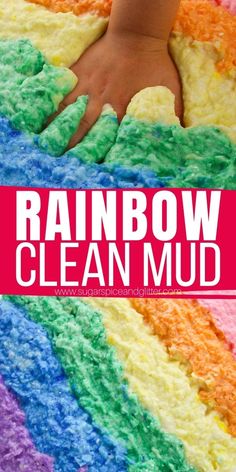 a child's hand on top of a rainbow cake with the words rainbow clean mud