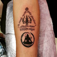 a person with a tattoo on their arm that reads, buddha and the words in different languages