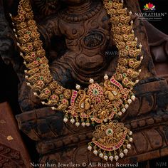 This masterfully crafted set of adornments, wrought from the finest materials and embellished with a tasteful array of precious gems, is sure to bedazzle all who behold it. We are open from 10 am to 8 pm 𝐋 𝐨 𝐜 𝐚 𝐭 𝐢 𝐨 𝐧 : M.G. ROAD, JAYANAGAR, RAJAJINAGAR, C T STREET For Enquiry: +91 9108701007 #navrathan #navrathanjewellers #jewelers #jewellerydesign #JewelleryAddicts #jewellerylovers #expressyourself #jewelryaddict #classyjewelry #luxuryjewelry #timeless #grace #signature #opulence #br Long Chain Designs, Gold Woven Bracelet, Heavy Necklace, Indian Wedding Jewelry Sets, Gold Bridal Jewellery Sets, Half Saree Designs, Woven Bracelet