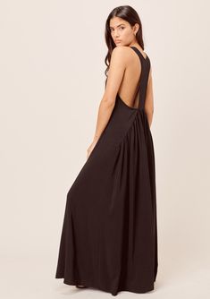 Keep it cool with our elegant, lightweight, and flowy maxi dress! Featuring a subtle tiered skirt and a sexy racerback detail. An effortless silhouette and easy boho-chic layering piece that looks great worn loose or belted for a waist-defining look. FINAL SALE Relaxed fit Sleeveless Maxi Length Scoop neckline Drop waist Model is 5'10, wearing a size S in Black.Model is 5'9, wearing a size S in Olive.Style: I-71853W-PSW Long Layered Necklaces, Common Thread, Boho Chic Dress, Spring Look, Flowy Maxi Dress, Backless Maxi Dresses, Layer Dress, Tiered Maxi Dress, Spring Looks