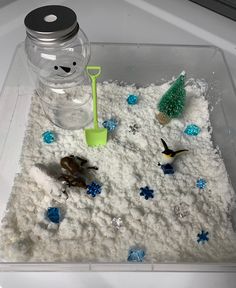 Winter Themed Sensory Bin Included in this bin: Snow - This snow is cold to the touch, is moldable and has a pleasant scent! Snowman Shovel 3 Arctic Animals - Polar Bear, Reindeer, Penguin 10 Ice Jewels 5 Snow flakes Tree Bin with lid - bin pictured is 10x10 *BONUS* - Laminated postcard with ideas for play and language promotion! Themed sensory bins offer a variety of language and play opportunities. As a Pediatric Speech-Language Pathologist and a mom to a toddler, I find sensory bins both educ Holiday Sensory Bin, Winter Sensory Table, Snow Sensory Bin, Friendship Activities Preschool, Themed Sensory Bins, Christmas Sensory Bin, Winter Sensory Bin, Winter Sensory, Educational Activities For Toddlers