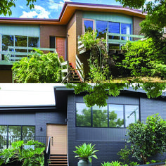 the front of a house with trees and plants on the outside, stairs leading up to the second floor