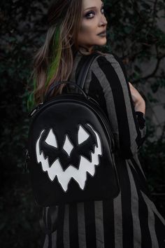 100% Cruelty-Free Vegan Leather Backpack! Perfect for transporting all of the candy you will get this year! Details:15" Tall (w/ Handle) x 11" Wide x 6" Deep37" Adjustable StrapSilver HardwareDual compartment openings along the top for access to front & backSleeves on either side of the bag, perfect for slipping a phone or keys into***Care: Gently scrub with warm water and soap*** By Lively Ghosts Black Halloween Standard Backpack, Black Standard Backpack For Halloween, Black School Bag For Halloween, Black Backpack For Halloween Travel, Halloween School Backpack, White Halloween Backpack For Travel, Black Halloween Backpack, Halloween White Backpack, White Halloween Backpack