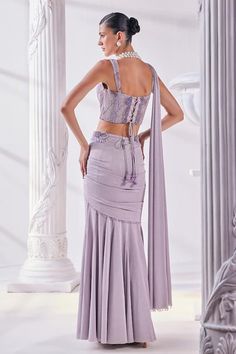 Lilac pre-draped saree crafted from shimmer lycra. Paired with a cutdana and bead embellished corset and cutwork embroidered belt with tassels. - Aza Fashions Embellished Corset, Embroidered Corset, Draped Saree, Embroidered Belt, Drape Saree, Beaded Neckline, Cut Work, Set For Women, Aza Fashion