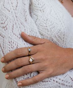 A little bijou for yourself or from a lover, the Opal Heart Signet Ring features a 4mm natural white opal from Australia set in a solid 14k gold band. Each opal is unique, just like you. Contact us to customize the size info@talonnyc.com. White Opal Signet Ring, Heart Signet Ring, White Opal, Gold Band, Signet Ring, Gold Bands, Like You, Opal, Contact Us