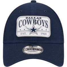 Keep your Dallas Cowboys fandom rolling along for the long haul with this Plate Trucker 9FORTY hat from New Era. It features the team name, logo and founding year displayed across the front. Mesh panels provide a breezy feel, and a snap closure makes adjusting the fit of this Dallas Cowboys cap quick and simple. Brand: New Era Officially licensed Material: 100% Polyester Structured fit Two solid front panels with eyelets Snap Closure Curved bill Mid Crown Wipe clean with a damp cloth Imported Em Curved Bill Hat With Team Logo For Sports Event, Curved Bill Hats With Letter Print For Fans, Snapback Trucker Hat With Team Logo, Baseball Cap With Team Logo For Fans, Team Logo Baseball Cap For Fans, Sporty Snapback Hat With Team Logo For Fans, Team-colored Trucker Hat With Embroidered Logo For Fans, Collegiate Hats With Logo Patch For Game Day, Team-colored Baseball Cap With Logo Patch For Fans