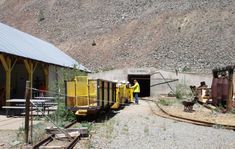 a man standing in the doorway of a train station