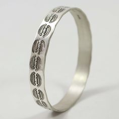 Sterling Silver Bangle Bracelet with Hand-Stamped Designs. .375” Bangle Width, 8” Inner Circumference The Bangles, Silver Bangle Bracelet, Sterling Silver Bangle Bracelets, Sterling Silver Bangle, Silver Bangle Bracelets, Sterling Silver Bangles, Silver Bangle, Silver Bangles, Bangle Bracelet