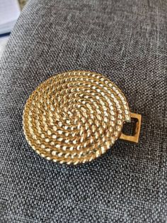 This is a vintage gold tone metal belt buckle from 1982 that is stamped with the date and the brand Jeanne Bouchever. It measures 1.75 in wide and is in excellent condition. May have had another half that clipped onto it but is a great piece for repurposing even without it. Please see my shop for other belt buckles and vintage jewelry Classic Antique Gold Belt Buckle, Classic Gold Antique Buckle Belt Buckles, Gold Antique Buckle Vintage Belt, 70s Belt Buckle, Vintage Brass Buckle Belt Buckles Collectible, Metal Belt, Classic Gold, Suspender Belt, Gold Tone Metal