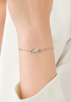 Bowtie dainty bracelet in sterling silver Chic Sterling Silver Bracelet As A Gift, Chic Sterling Silver Bracelet Gift, Trendy Sterling Silver Chain Bracelet With Lobster Clasp, Chic Metal Jewelry With Bow Detail, Trendy Infinity Jewelry, Chic Silver Chain Bracelet For Formal Occasions, Feminine Silver Jewelry With Bow, Chic Bracelet With Delicate Chain For Gift, Delicate Silver Jewelry With Bow Detail