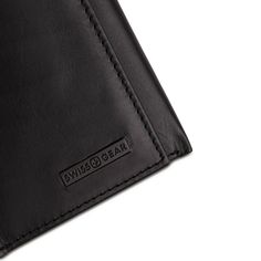 Tired of your old stretched out wallet? Using rubber bands to hold your cards and cash together? It’s time for a wallet that carries more in less space and looks great with everything. The Swissgear Trifold Wallet in black Napa leather gives you the convenience of a lightweight, compact size wallet when folded with plenty of capacity for everything you need. The inside of this small but mighty wallet is finished with four card slots, two slip pockets, one identification window and a large, lined Black Trifold Wallet With Interior Card Slots, Black Trifold Card Holder For Daily Use, Black Trifold Wallet For Everyday, Black Trifold Wallet For Daily Use, Black Trifold Wallet For Everyday Use, Modern Black Trifold Wallet For Daily Use, Black Trifold Wallet With Card Slots For Everyday, Modern Black Trifold Wallet For Everyday Use, Black Leather Trifold Wallet For Everyday