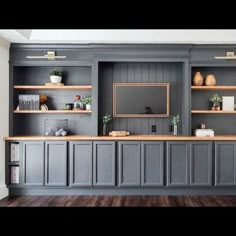 an entertainment center with built in cabinets and shelves