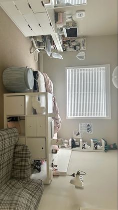 a living room filled with furniture and lots of clutter on top of the shelves