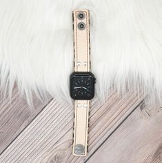 Perfect for those who love a simple natural look. Our natural leather is of the highest quality and softest material. Every piece cut from the leather is unique, with its own imperfections and natural marks. Each band is just as distinctive as our skin, unlike anyone else’s, and with its own story to tell. Apple Watch Skinny Band Vachetta leather stitched to Leopard Leather Embellishments and Adapters will be matched to Apple Watch Color Approximately 1" wide Adjustable snap closure