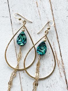 "The Alohi Earrings are made with 14 kt gold fill teardrop shaped hoops, ear wire and sparkly gold fill chain accents. The focal in the middle is a vibrant blue Paua shell teardrop and gold fill bead. These earrings hang about 3\" down from the bottom of the ear wire with the chain and 1 1/8\" wide." 14k Gold Filled Teardrop Earrings, Handmade Teardrop Chandelier Earrings In 14k Gold Filled, Pierced Teardrop 14k Gold Filled Earrings, Teardrop Chandelier Earrings In 14k Gold Filled For Gift, Teardrop 14k Gold Filled Chandelier Earrings As Gift, Handmade Gold Teardrop Earrings, Teardrop 14k Gold Filled Hoop Earrings, Teardrop Ear Wire Jewelry For Beach, Handmade Teardrop 14k Gold Filled Chandelier Earrings