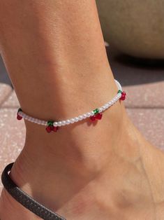 This trendy cherry and pearl beaded anklet is handmade and finished with an adorable dangling cherry. Adjustable design, length options below.  Length options:  8 inches with 1 inch extender 9 inches with 1 inch extender Diy Anklet Beaded, Anklets Beads, Anklet Stack, Handmade Anklets, Cherry Picking, Beaded Anklet, Scrapbook Book, Trendy Outfits For Teens, Beaded Anklets