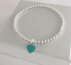 925 Sterling Silver Stretch Turquoise Heart Bracelet4mm Sterling Silver Beads10mm Sterling Silver Enamel HeartStack of 2 includes:one Heart Braceletone 4mm Plain BraceletStack of 3 includes:one Heart Braceletone 4mm Plain Braceletone 5mm Plain Bracelet*PRICE SHOWN IS FOR 1 HEART BRACELET ONLY*This bracelet is perfect for stacking or just wear on its ownFREE SHIPPING to Canada & U.S.A Plain Bracelet, Stacked Bracelets, Tube Bracelet, Bracelets Charm, Sterling Silver Bead Bracelet, Turquoise Heart, Silver Bead Bracelet, Photo Bracelet, Silver Enamel