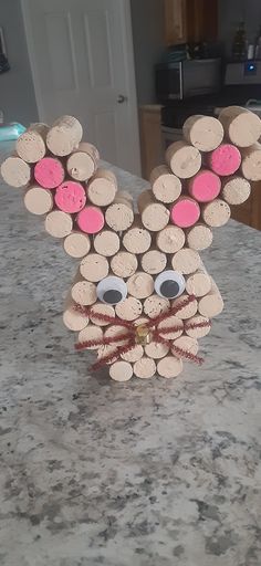 a close up of a bunny made out of wine corks on a kitchen counter