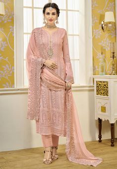 Faux Georgette Pakistani Suit in Pink This Semi-stitched Attire with Poly Shantoon Lining is Enhanced with Resham, Zari, Cutbeads and Beads Work. Crafted in Notched Round Neck and Bell Sleeves Available with a Poly Shantoon Pant and a Faux Georgette Dupatta in Pink The Kameez and Bottom Lengths are 46 and 38 inches respectively Do note: Accessories shown in the image are for presentation purpose only and length may vary upto 2 inches.(Slight variation in actual color vs. image is possible). Gown Style Dress, Celana Fashion, Indian Salwar Suit, Look Festival, Lehenga Gown, Set Saree, Gaun Fashion, Kurti Neck, Designer Suit