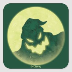 the silhouette of a man with a hat on his head in front of a full moon