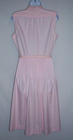 "Vintage Alfred Shaheen pale pearl pastel pink pleated midi dress. Excellent pre-owned condition. No holes, stains, rips, tears,etc. Women's size MEDIUM or 10 or 12, (marked a vintage size 14). Measurements: bust-42\", waist-30\", hips-64\", length-45\". 100% polyester. Belted. Lovely!" Pink Fitted A-line Pleated Dress, Pink Sleeveless Pleated Dress For Spring, Sleeveless Pink Pleated Summer Dress, Pink A-line Pleated Summer Dress, Fitted Pink Pleated Dress With Pleated Bodice, Pink Midi Pleated Dress, Pink Pleated Dress With Pleated Bodice For Summer, Feminine Pink Pleated Summer Dress, Pink Pleated Bodice Dress For Summer