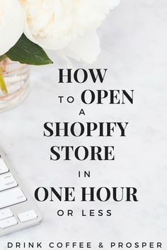 a keyboard and flowers on a table with the words how to open a shopify store in one hour or less