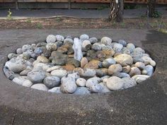 a fire hydrant with rocks around it