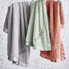 three towels hanging on a clothes line