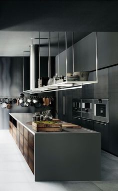 a modern kitchen with stainless steel appliances and cabinets