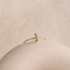 A stacking ring with a natural green tsavorite garnet in 14K solid gold. A minimalist everyday ring 3 stone ring for women with genuine gemstones. 100% handcrafted with love! * Material: 14K solid white gold, 14K yellow gold * Gemstone: Tsavorite, round cut * Gemstone's Weight: 0.06 ct HOW TO ORDER * Choose from the drop-down menus the available options (Ring size, Material) and leave us a note for any special requirements. PRODUCTION TIME - SHIPPING POLICIES * Please keep in mind that each item Green Open Ring Stackable Rings For May Birthstone, Dainty Green 14k Gold Stackable Rings, Green Stackable Open Rings For May Birthstone, Green Minimalist Stackable Open Rings, Green Minimalist Open Stackable Rings, Minimalist Green Stackable Open Rings, Green Emerald Stackable Rings In Minimalist Style, Everyday Green 14k Gold Stackable Rings, Minimalist Green Emerald Open Ring