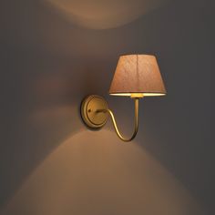 a wall light with a lamp on it