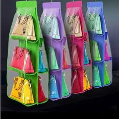 multicolored purses hanging from hooks on the wall in a store or office