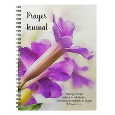 a spiral notebook with the words prayer journal written on it