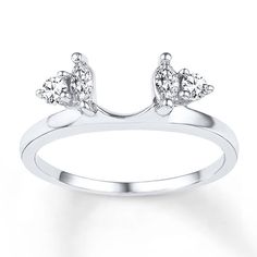 a white gold ring with three diamonds on it