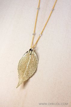 A beautifully ethereal necklace that is ideal for the fall season, bring a flash of warmth to everyday with this gold dipped evergreen leaf necklace. The perfect fall necklace that will speak volumes for your personal style, select your preferred pendant and opt to wear the piece long or layered. Studded with blue labradorite beads subtly along the chain, this naturally-inspired necklace is bound to capture attention endlessly. ❥ Pendant Size variations:A - 33x73mm / 1.5" x 3.25"B - 35x74mm / 1. Nature-inspired Gold Leaf Necklace, Gold Leaf-shaped Nature-inspired Necklace, Ethereal Necklace, Aries Birthstone, Fall Necklace, Custom Birthstone Ring, Real Leaf, Autumn Necklace, Real Leaves