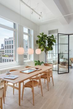 a dining room with wooden tables and chairs