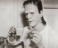 black and white photograph of a man eating cereal