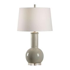 a table lamp with a white shade on it