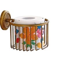 a toilet paper holder with flowers on it and a roll of tissue in the middle