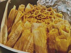 corn on the cob wrapped in tin foil and ready to be cooked for dinner